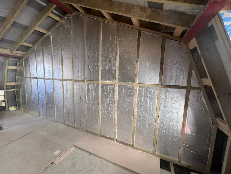 Fountain Road Roof Insulation Internal view of retrofit insulation in a mansard roof.