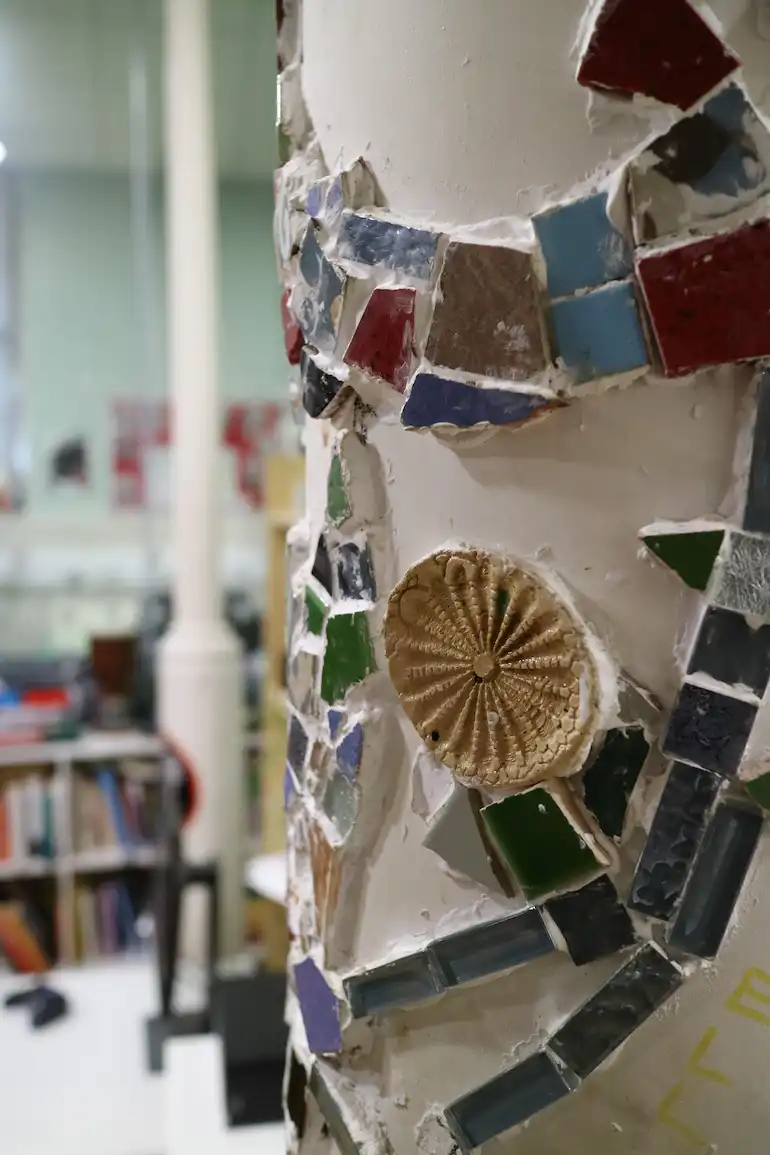 Jimmy's Cambridge Mosaic decoration on a column in Jimmy's Cambridge.