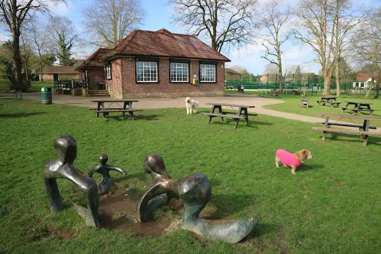 KGRG Café Photograph showing a park café, with a sculpture in the foreground.