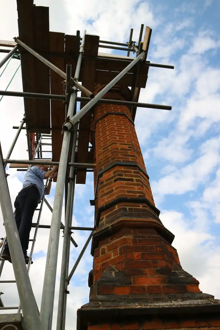 Photograph of a scaffolded heritage chimney